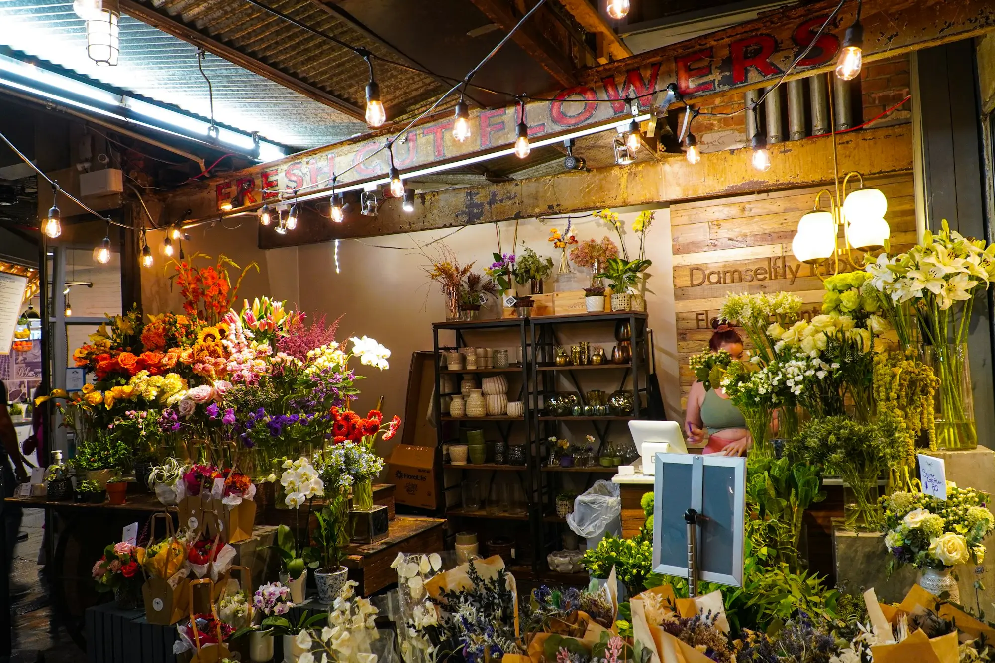 Florist shop stocked with buckets of fresh flowers