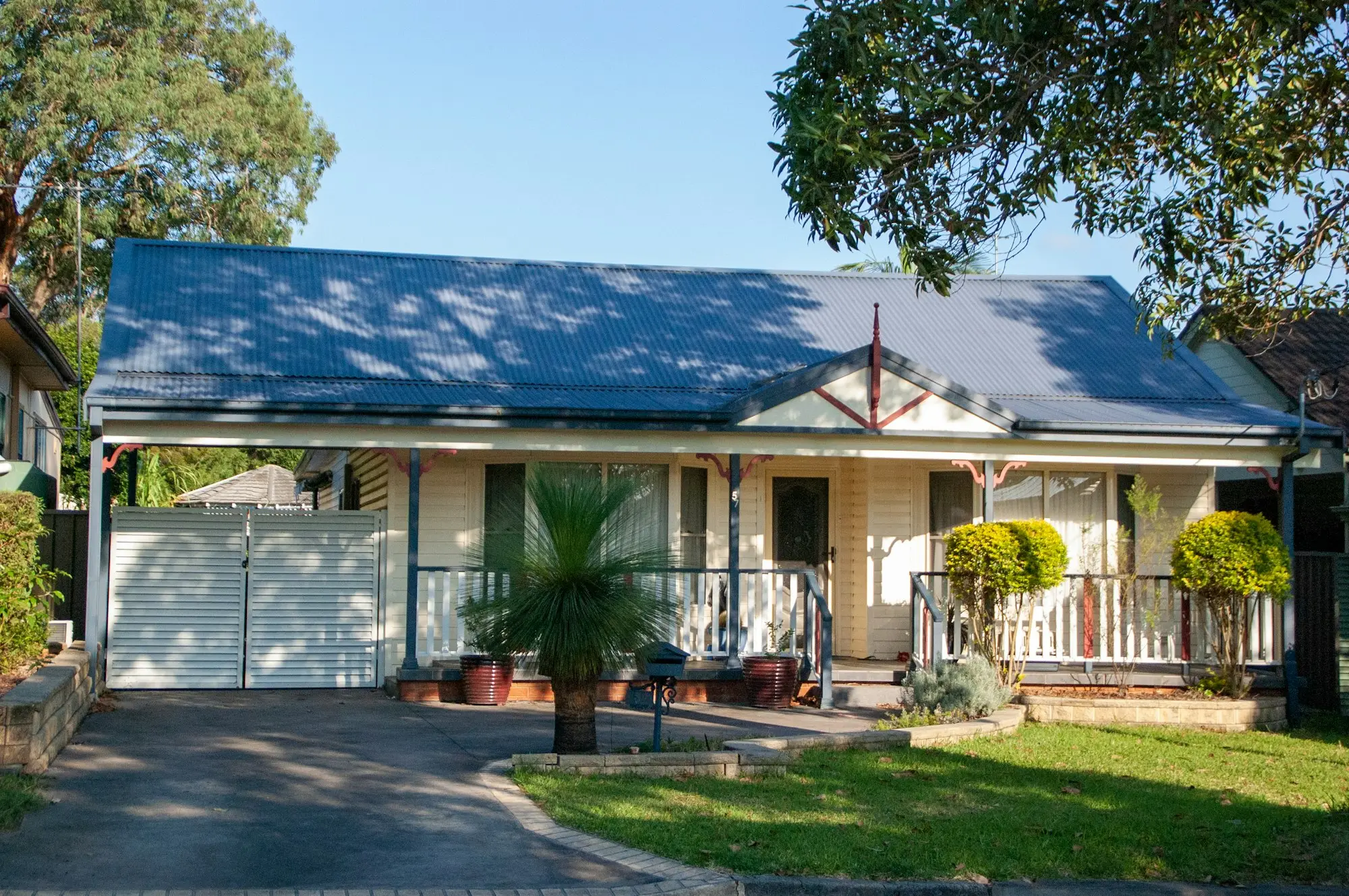 Suburban Australian house with a front garden and driveway